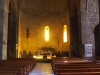 Església parroquial de Sant Esteve – Bagà - Fotografia obtiunguda a través del vidre que separa l'església del cancell d'entrada.