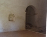 Església de Sant Cebrià dels Alls – Cruïlles, Monells i Sant Sadurní de l’Heura-Fotografia de l'interior de l'església, obtinguda introduint l'objectiu de la màquina de fotografiar per entremig de les barres de ferro de la porta d'entrada