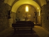 Església de Sant Miquel del Corb – Les Preses -Fotografia obtinguda introduint l'objectiu de la màquina de retratar a través de les barres de ferro de la porta d'entrada.