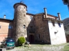 Església parroquial de Santa Maria de Riudaura - A l'esquerra de la fotografia, apareix la Torre Rodona